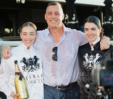 Tony Gollan with Emily Lang and Angela Jones, two of the stable's apprentice jockey success stories 