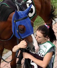 Still loved ... even if you come second. Rideonabigjetplane gets a kiss from the strapper in the pre-race parade