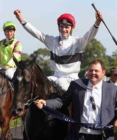 Sam Clipperton celebrates his first Group 1 win aboard Peeping in the Coolmore Stakes