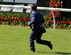 Man on track ... Chris Munce races out to me us after Ours To Keep had won the B J McLachlan Stakes at Eagle Farm on Saturday