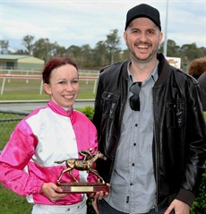Matthew Duncan presents the Jockey Challenge trophy to me on Kilcoy Cup day. The trophy was donated by the Duncan family