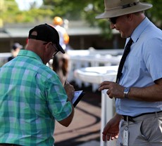 Toby Edmonds signs autographs after being named Queensland Racing Media Association (QRMA) Personality of the Year. 
