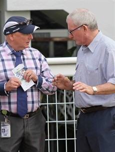 Jockey Advocate/Mentor Shane Scriven in discssion with Barry Lockwood, the trainer of Tumbler, at Doomben on Wednesday ...