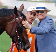 Two champions … Beauty Generation and his trainer John Moore