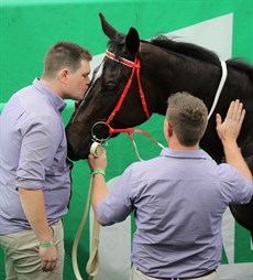 ... where she got a warm, loving welcome back at the winner's enclosure ...