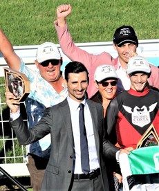 Plenty to celebrate ... Michael Costa, at the trophy presentation, surrounded by very happy connections after She Can Sing had taken out the Military Rose Plate