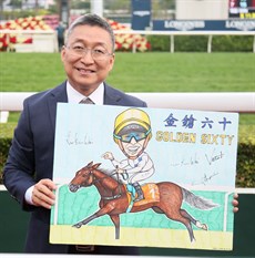 Francis Lui, the trainer of Golden Sixty, poses with Vieri's painting of the Hong Kong Champion