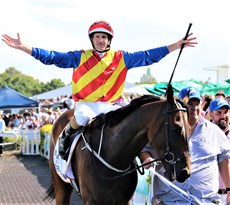 Hugh Bowman shows his pleasure after Eleven Eleven has landed his second successive win in the Magic Millions Cup in an absolute thriller