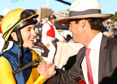 Lloyd with his boss James Cummings, who was the first to congratulate the young rider after he dismounted