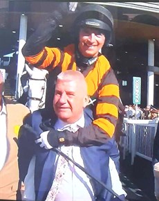 The jubilation of it all. Owner Stewart Andrew gives Patrick Mullins a piggy-back into the winners' enclosure

Photos: ITV