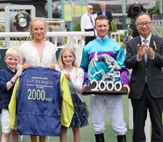 Zac Purton and his family with The Hon Martin Liao, Chairman, The Hong Kong Jockey Club, after the Australian rode a 2000th winner in Hong Kong.

Photo: Hong Kong Jockey Club